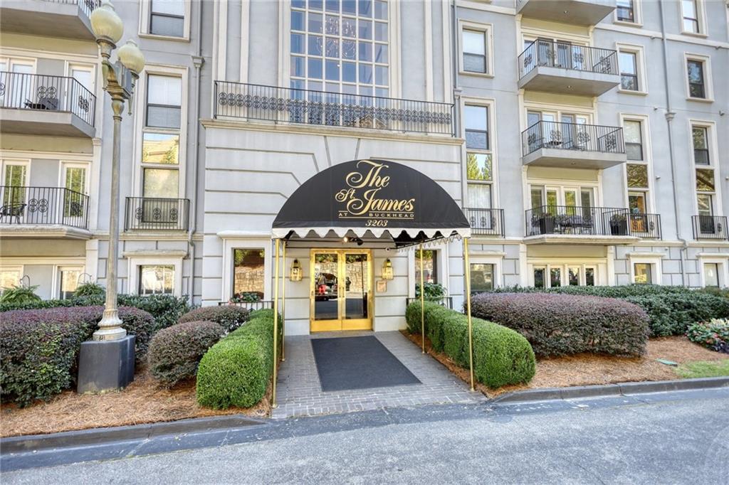 3203 Lenox Road Northeast, Unit 20 Atlanta, GA 30324 - Photo 1 of 1 a front view of a building with a garden