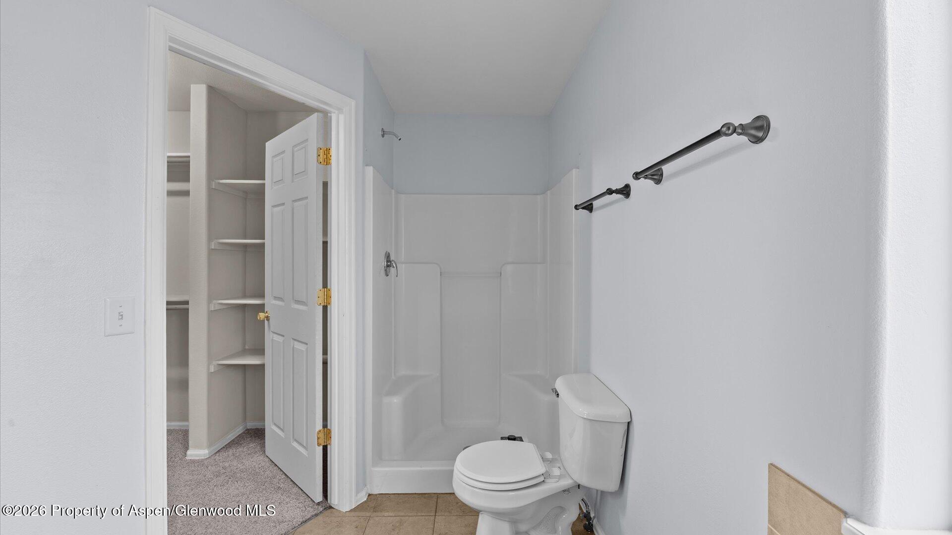 188 Cliff View Circle Parachute, CO 81635 - Photo 26 of 36 a bathroom with a toilet and a shower