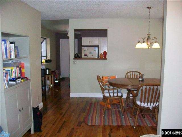 5310 Seville Court Reno, NV 89523 - Photo 3 of 9 a view of a dining room with furniture and wooden floor