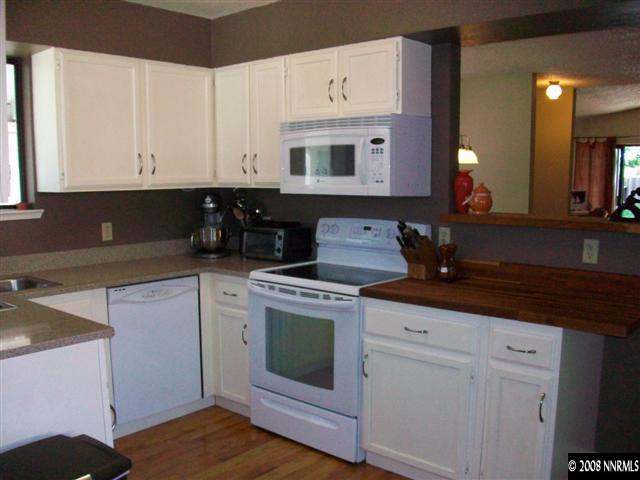 5310 Seville Court Reno, NV 89523 - Photo 4 of 9 a kitchen with cabinets and appliances