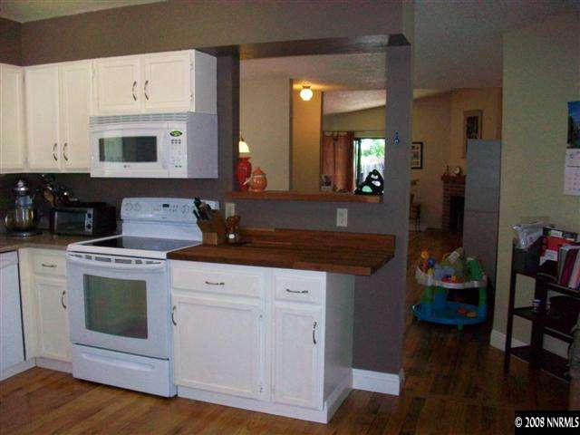 5310 Seville Court Reno, NV 89523 - Photo 5 of 9 a kitchen with stainless steel appliances granite countertop a stove a sink and a refrigerator