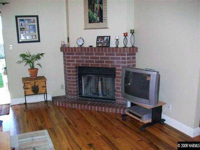 5310 Seville Court Reno, NV 89523 - Photo 6 of 9 a living room with furniture and a fireplace