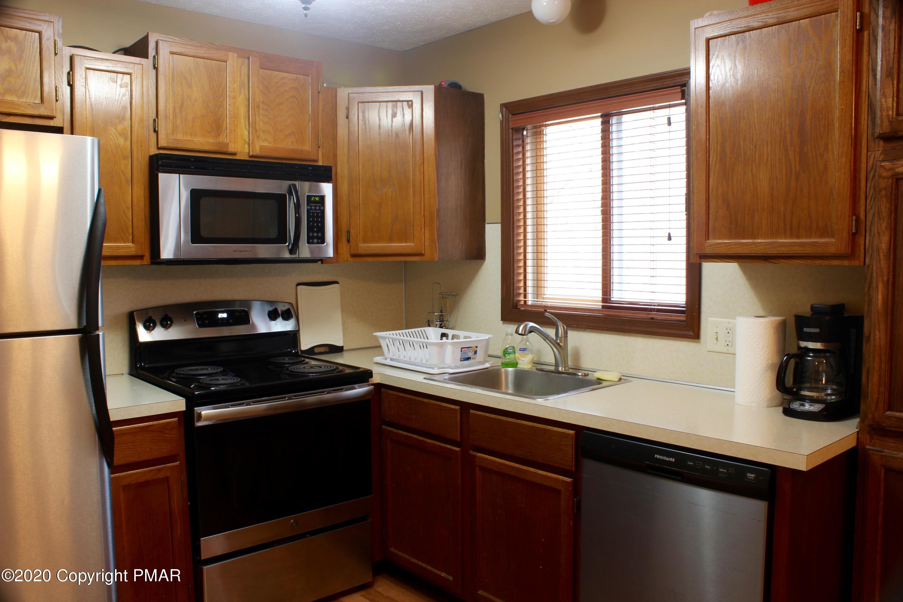 108 Sawmill Road Long Pond, PA 18334 - Photo 16 of 45 a kitchen with a sink stove and refrigerator