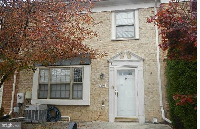 9896 Whiskey Run Laurel, MD 20723 - Photo 1 of 12 front view of a brick house with a small yard