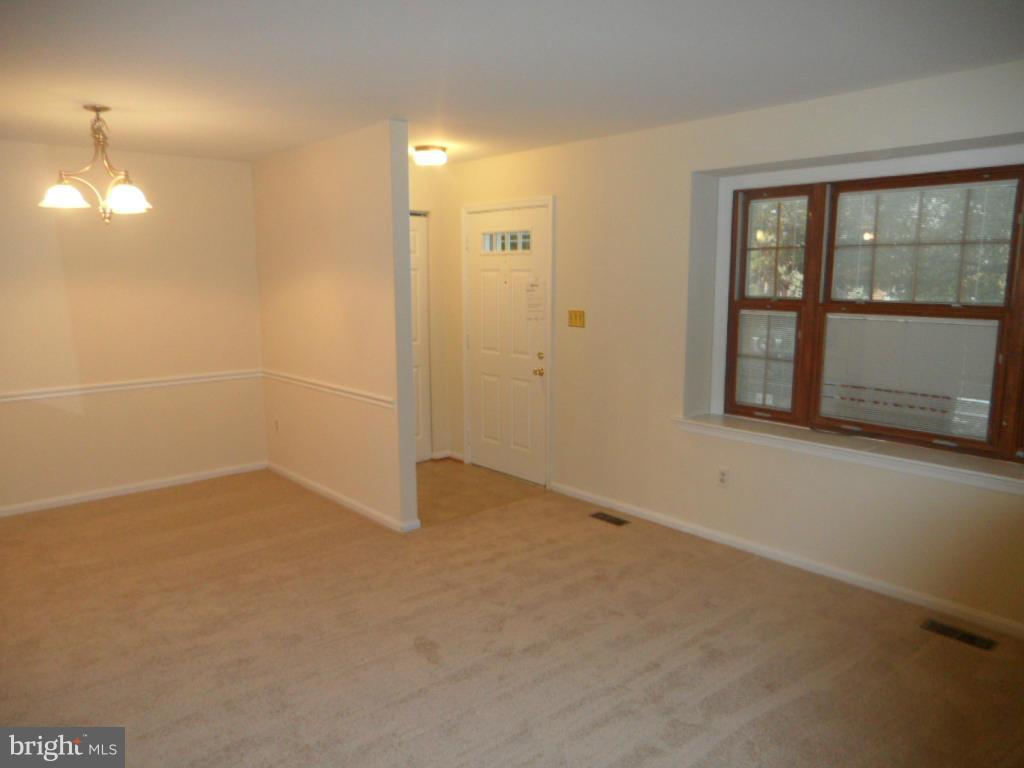 9896 Whiskey Run Laurel, MD 20723 - Photo 2 of 12 an empty room with windows and entrance