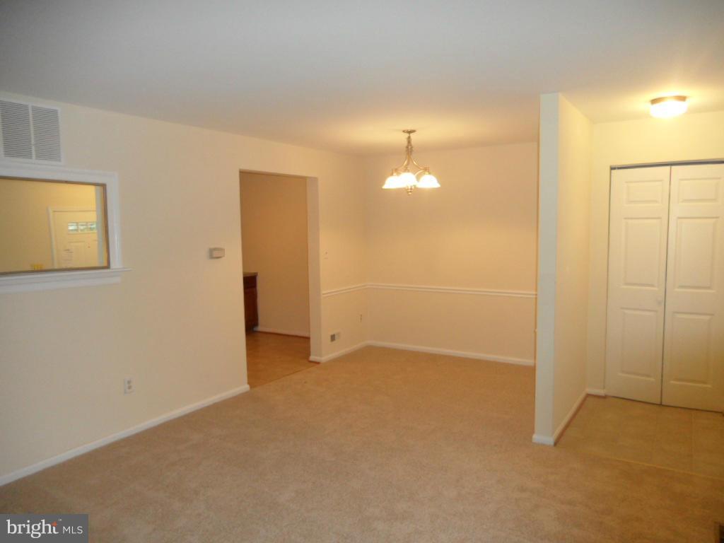 9896 Whiskey Run Laurel, MD 20723 - Photo 3 of 12 an empty room with a bathroom