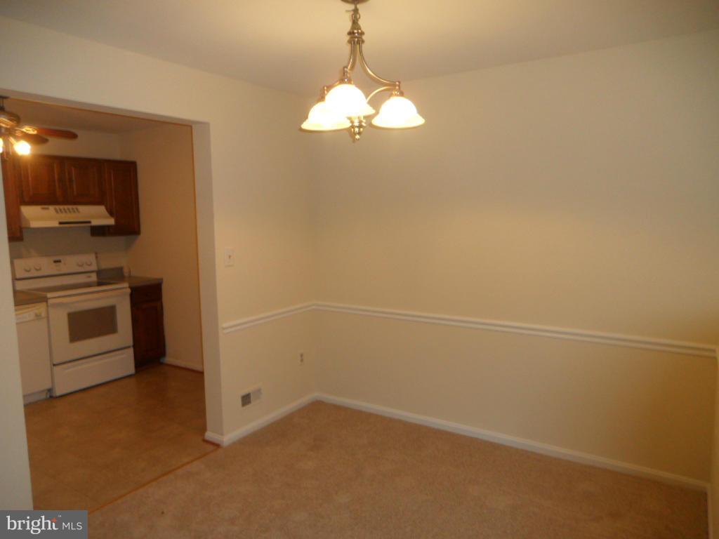 9896 Whiskey Run Laurel, MD 20723 - Photo 4 of 12 a view of a kitchen with a sink cabinets and a window