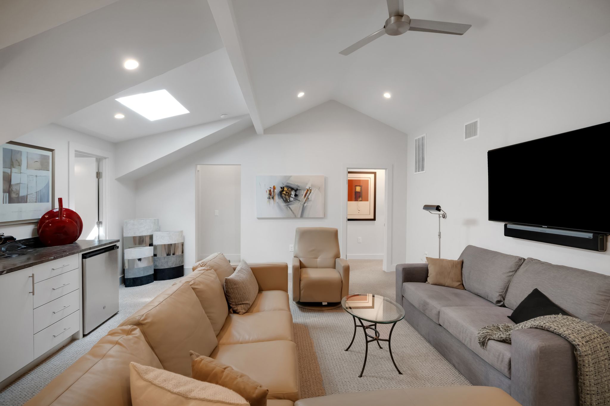 809 Bouldin Avenue Austin, TX 78704 - Photo 16 of 39 Living area with a skylight, light carpet, lofted ceiling, recessed lighting, and ceiling fan