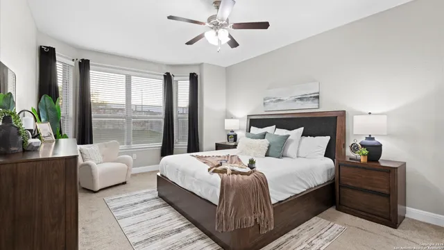 a bedroom with a bed and a mirror on dresser