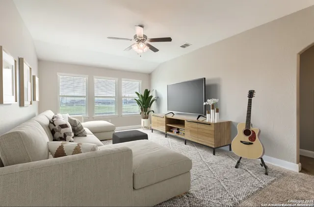 a view of a house with a yard and sitting area