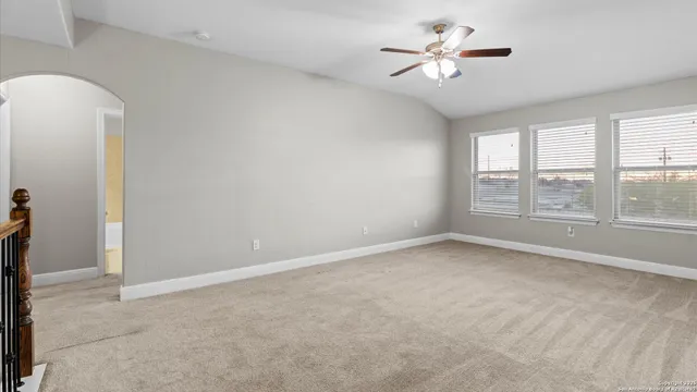 a front view of a house with a garden and yard