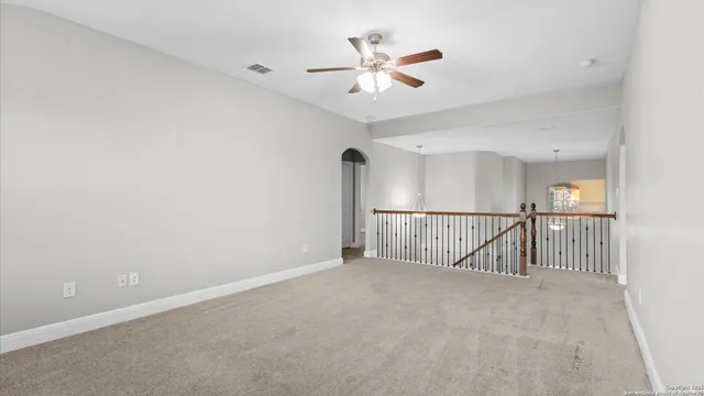 a view of a house with a backyard and a patio