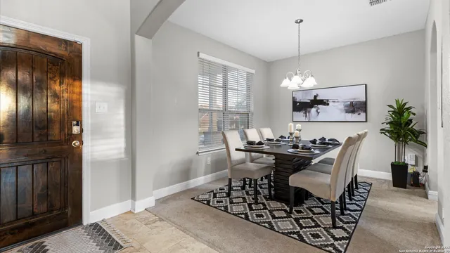 a view of a dining room with furniture window and outside view