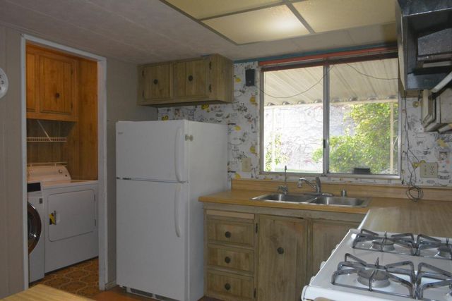 a view of a bathroom from a hallway