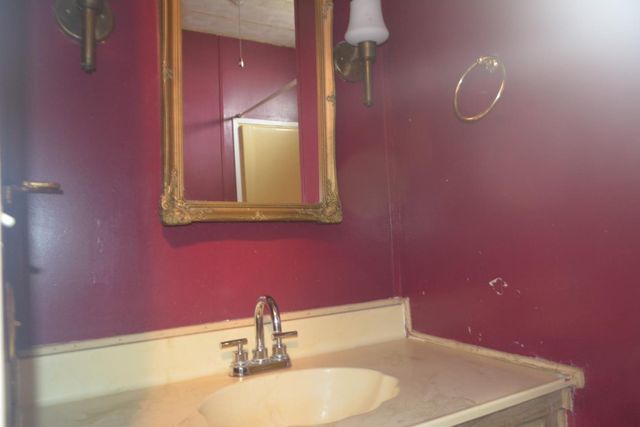 a white toilet sitting next to a shower curtain