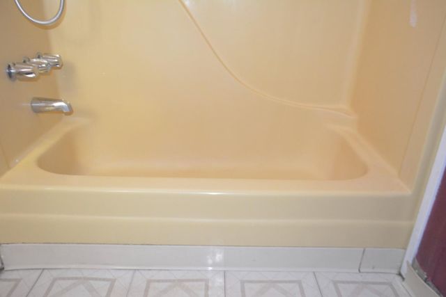 a room with a bed and a window