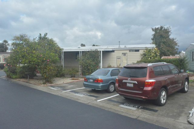 a car parked in the middle of a field