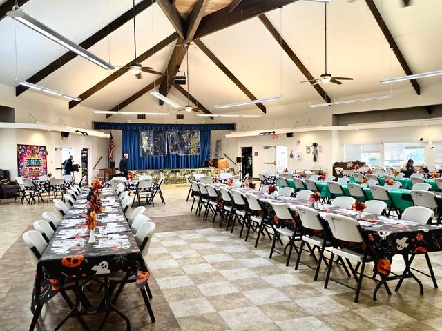 a living room with a table chairs and a table