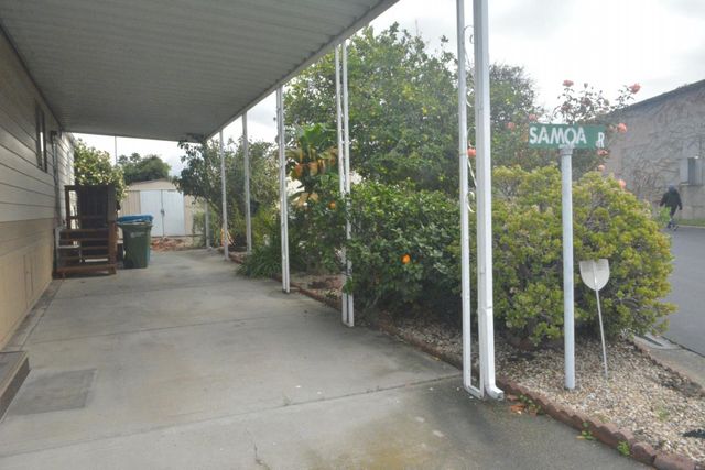 a view of a room with balcony and furniture