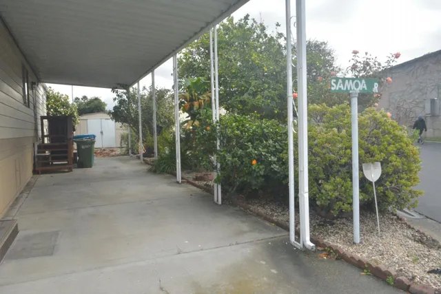 a view of a room with balcony and furniture