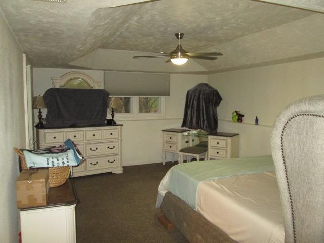 5747 Gray Eagle Road Roscoe, IL 61073 - Photo 20 of 39 a bedroom with a bed and a chandelier