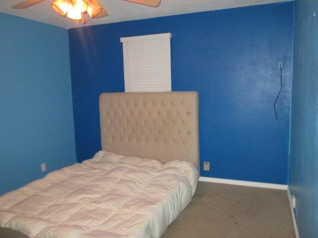 5747 Gray Eagle Road Roscoe, IL 61073 - Photo 27 of 39 a bed sitting in a bedroom next to a wall