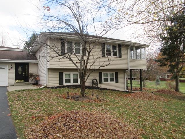 5747 Gray Eagle Road Roscoe, IL 61073 - Photo 36 of 39 front view of a house with a yard