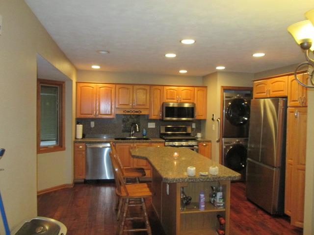 5747 Gray Eagle Road Roscoe, IL 61073 - Photo 8 of 39 a kitchen with stainless steel appliances a refrigerator and microwave