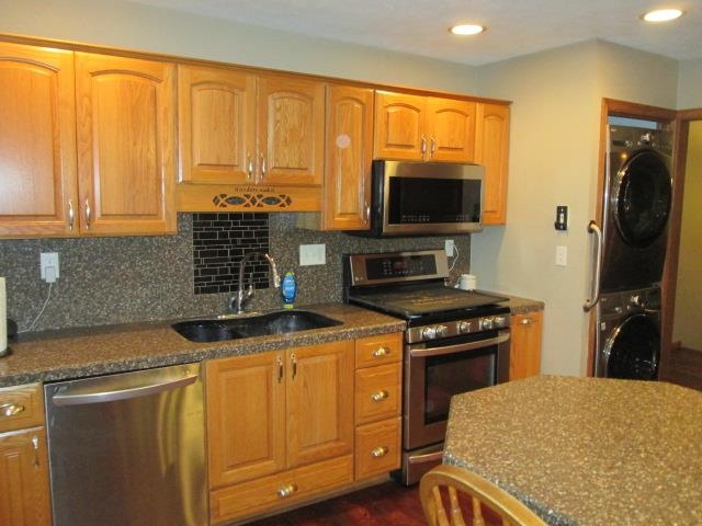 5747 Gray Eagle Road Roscoe, IL 61073 - Photo 10 of 39 a kitchen with a stove and a microwave