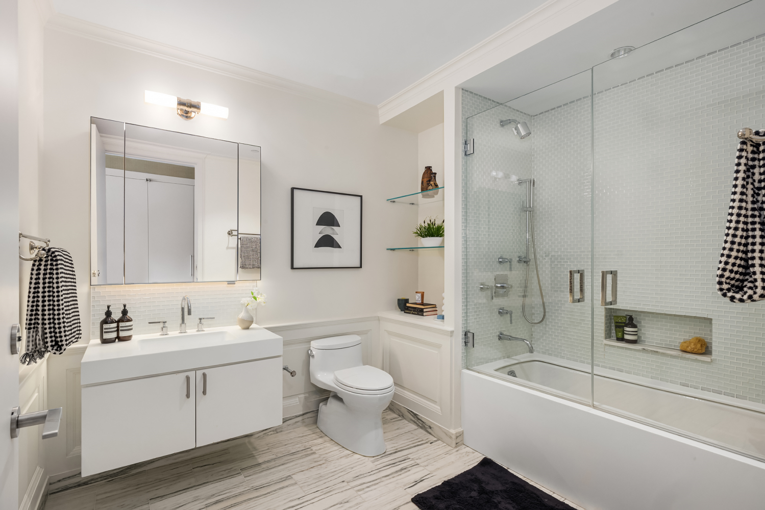 63 Greene Street, Unit PHA Manhattan, NY 10012 - Photo 15 of 20 a bathroom with a sink toilet tub and shower