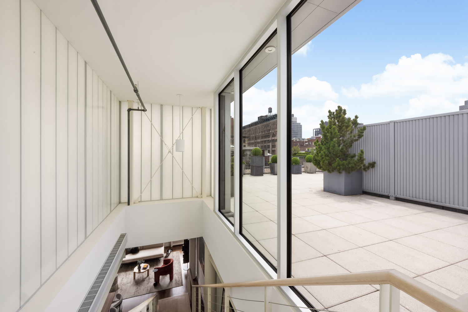 63 Greene Street, Unit PHA Manhattan, NY 10012 - Photo 18 of 20 a view of a balcony with wooden floor and furniture