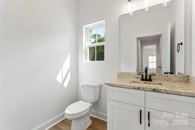 an empty room with a ceiling fan and a window