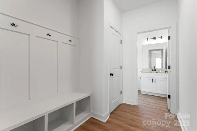a bathroom with a double vanity sink mirror double and bathtub