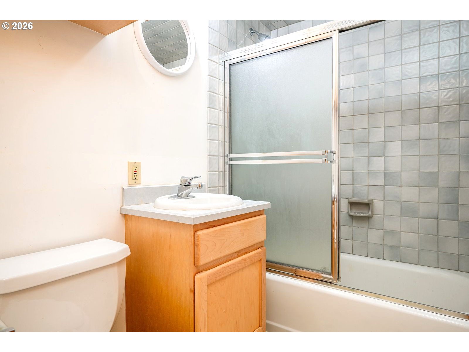 5815 Southwest Huddleson Street Portland, OR 97219 - Photo 20 of 35 a bathroom with a sink a toilet and shower