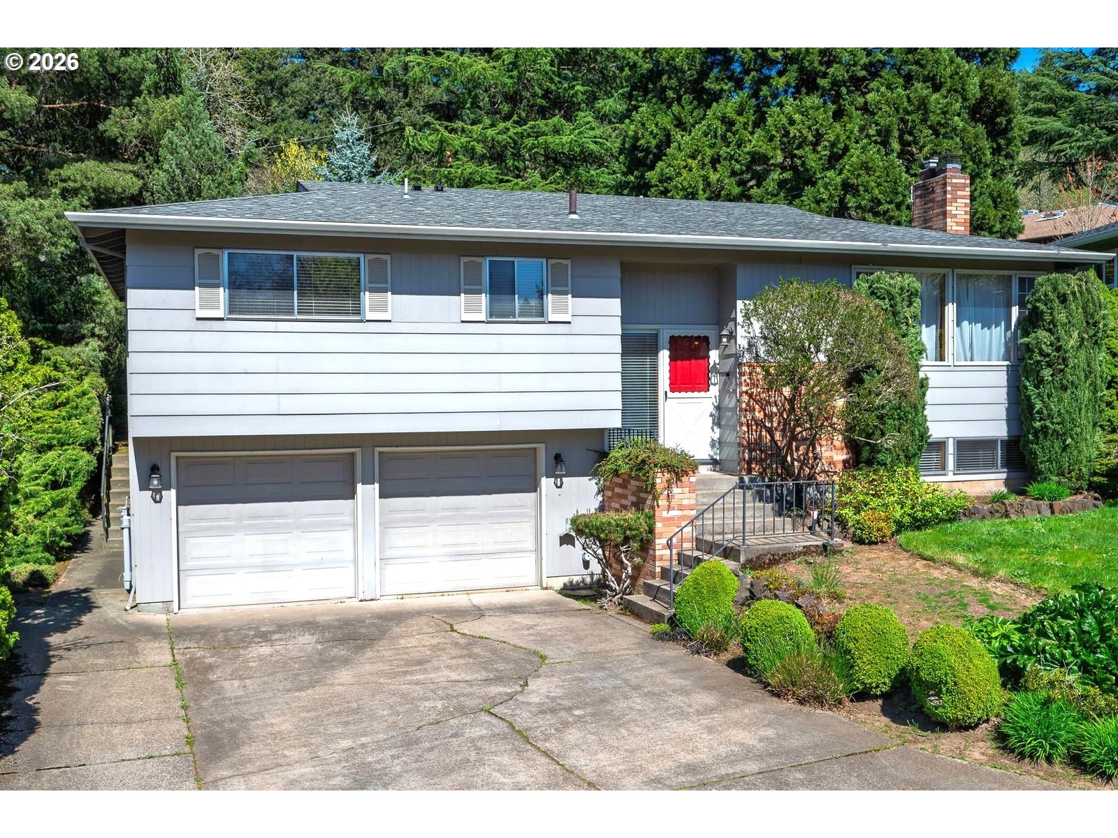 5815 Southwest Huddleson Street Portland, OR 97219 - Photo 2 of 35 a house view with a backyard space