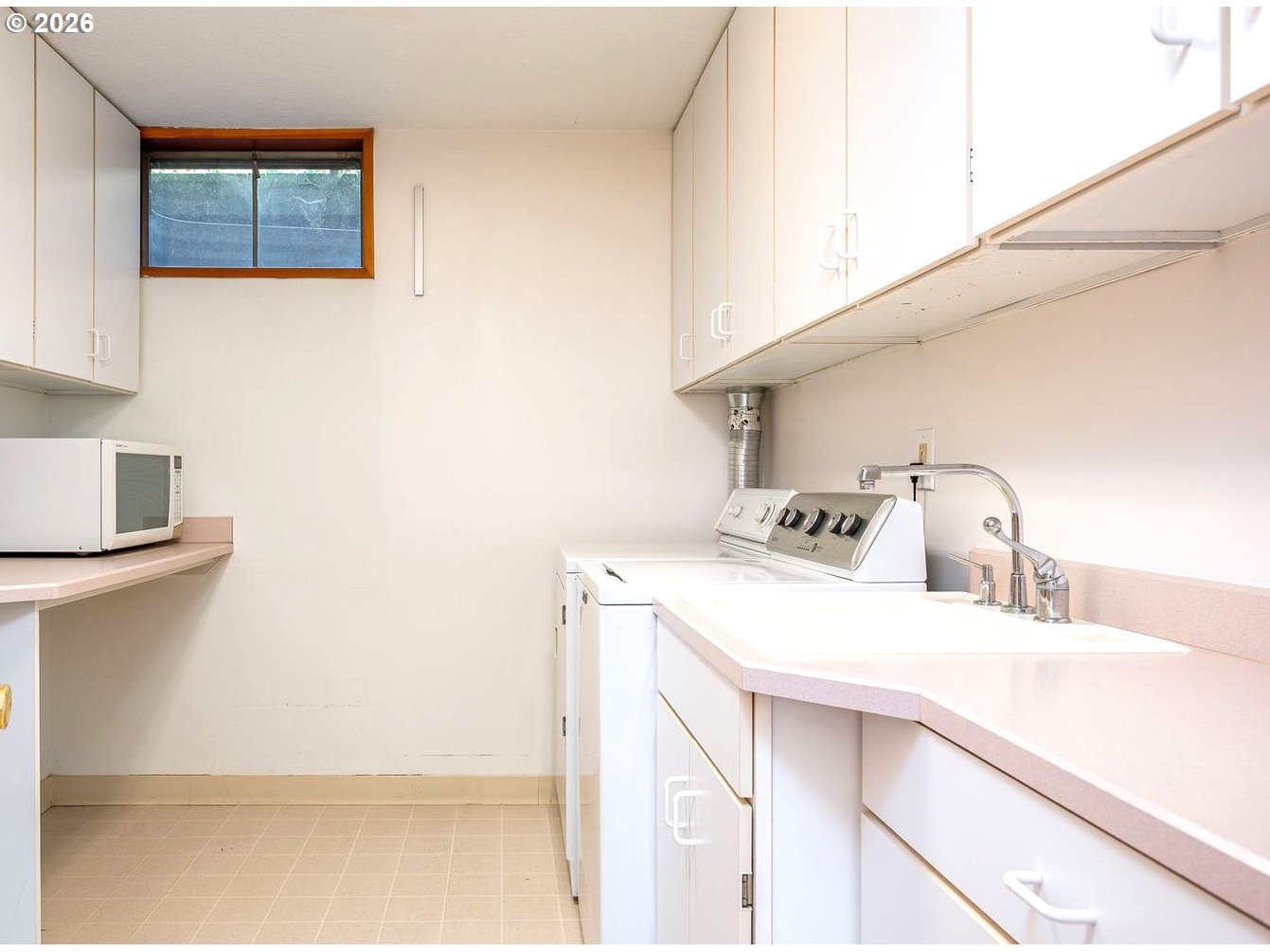 5815 Southwest Huddleson Street Portland, OR 97219 - Photo 21 of 35 a utility room with sink dryer and washer