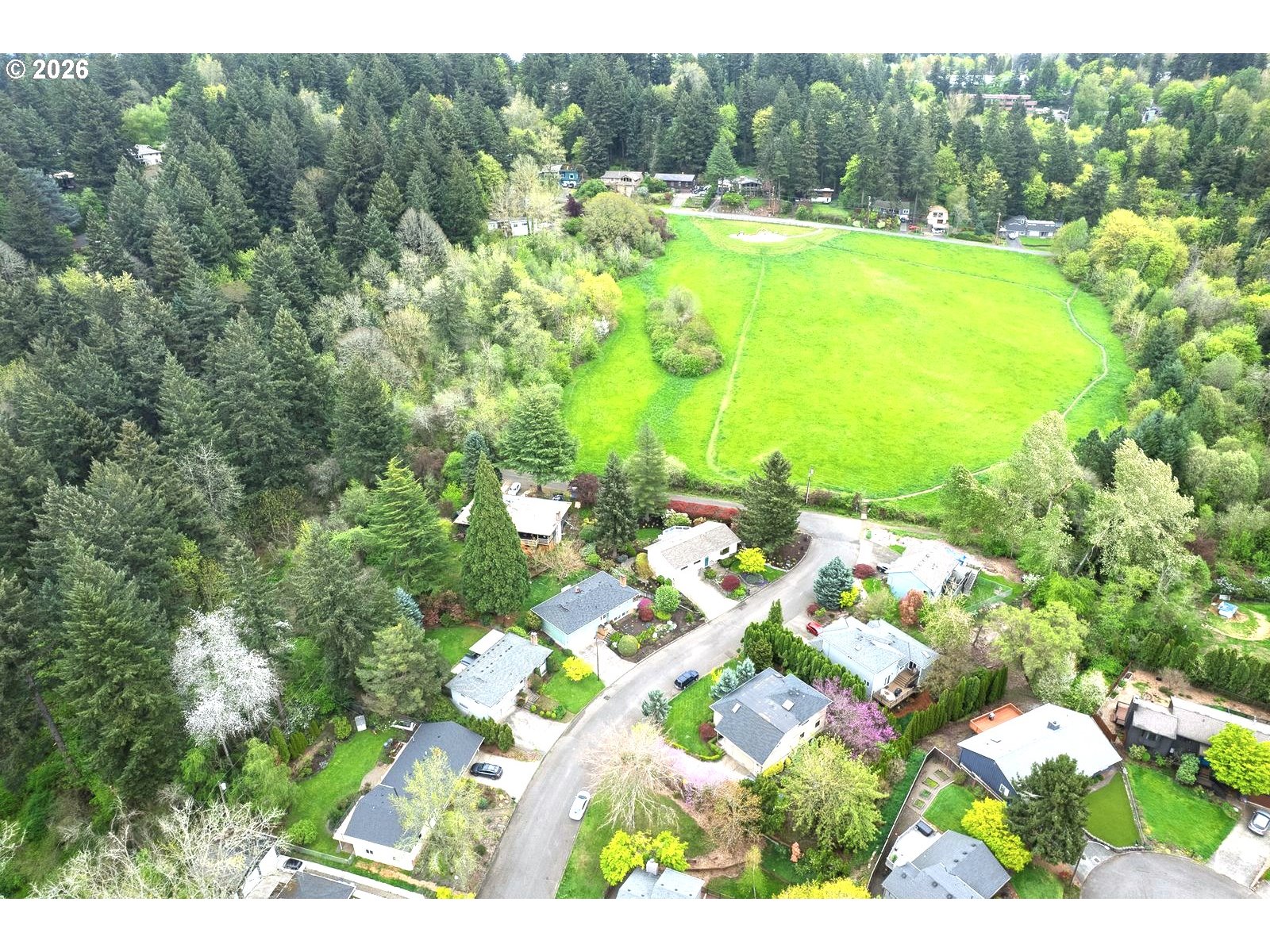 5815 Southwest Huddleson Street Portland, OR 97219 - Photo 3 of 35 a view of a lake with houses