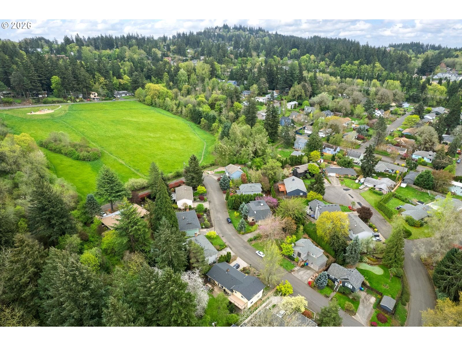 5815 Southwest Huddleson Street Portland, OR 97219 - Photo 32 of 35 a view of a city with lush green forest
