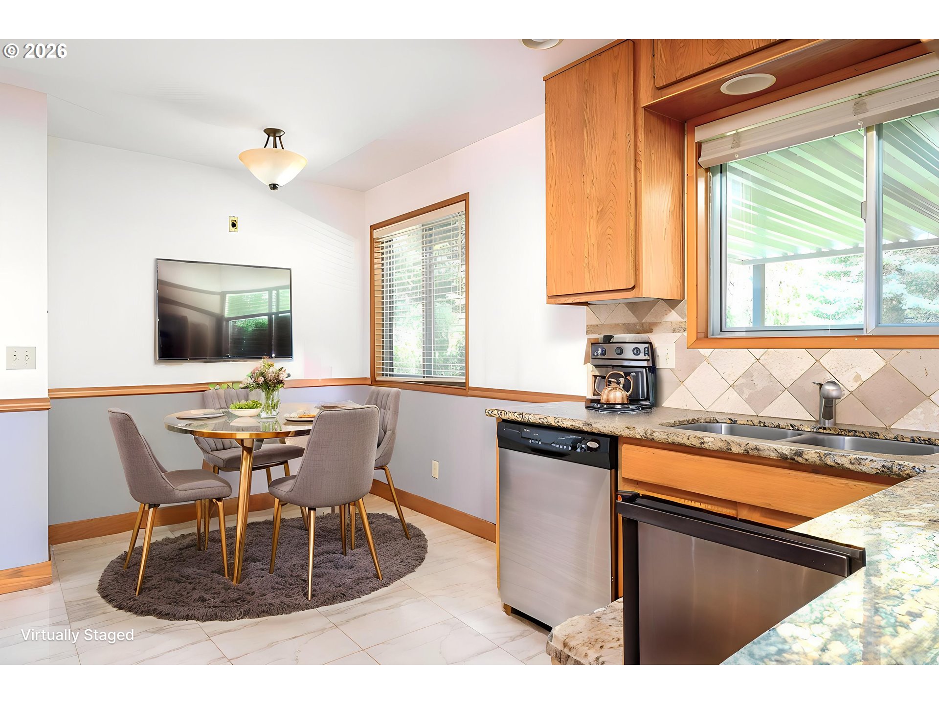 5815 Southwest Huddleson Street Portland, OR 97219 - Photo 9 of 35 a kitchen with a table chairs and a window