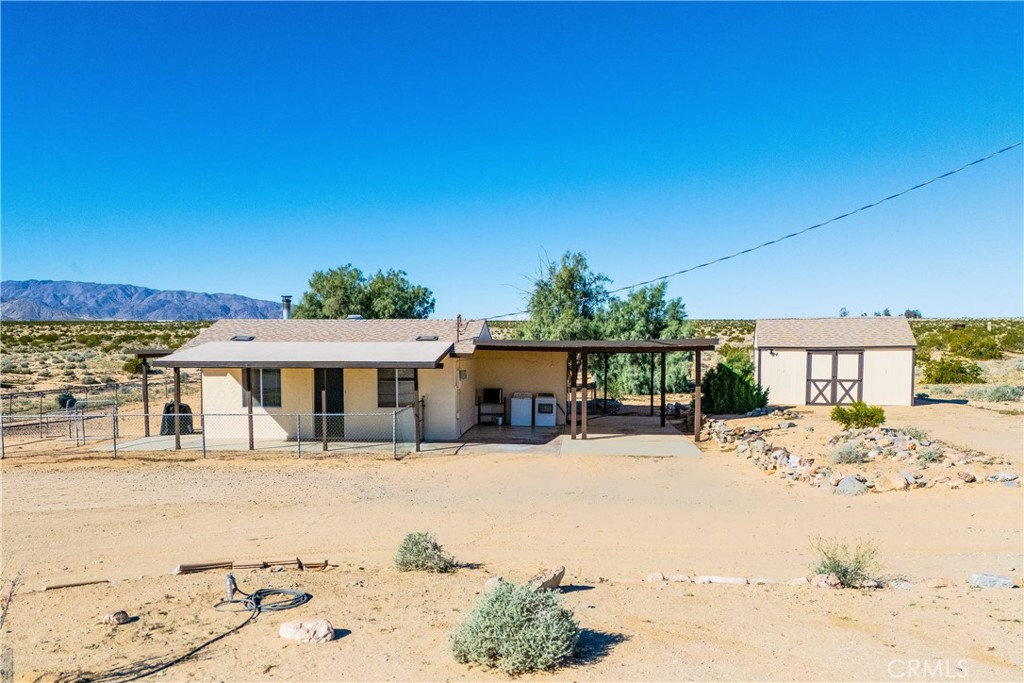 5828 Steeg Road Twentynine Palms, CA 92277 - Photo 2 of 66 a front view of a house with a patio