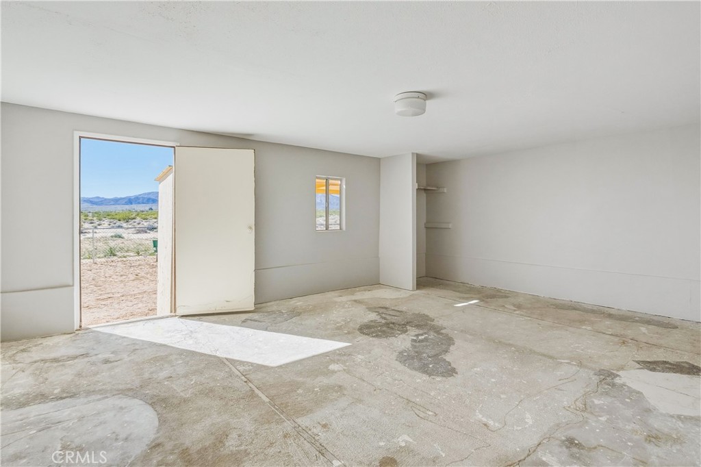 5828 Steeg Road Twentynine Palms, CA 92277 - Photo 30 of 66 a view of an empty room and window