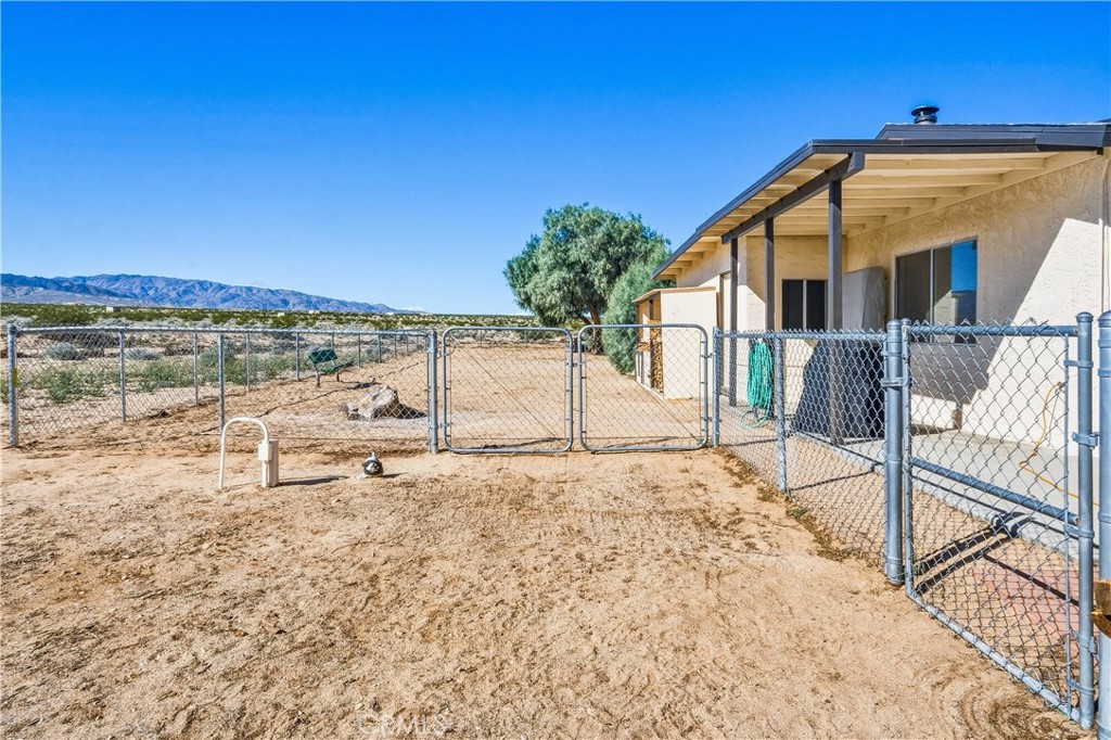 5828 Steeg Road Twentynine Palms, CA 92277 - Photo 33 of 66 a view of a house with a outdoor space