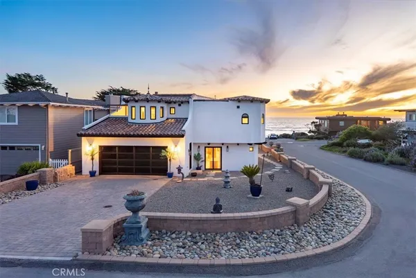 an aerial view of a house with a swimming pool outdoor seating and yard