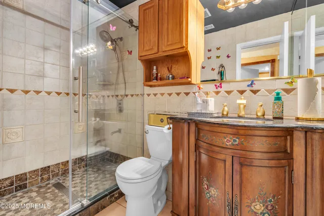 a bedroom with bed and wooden floor