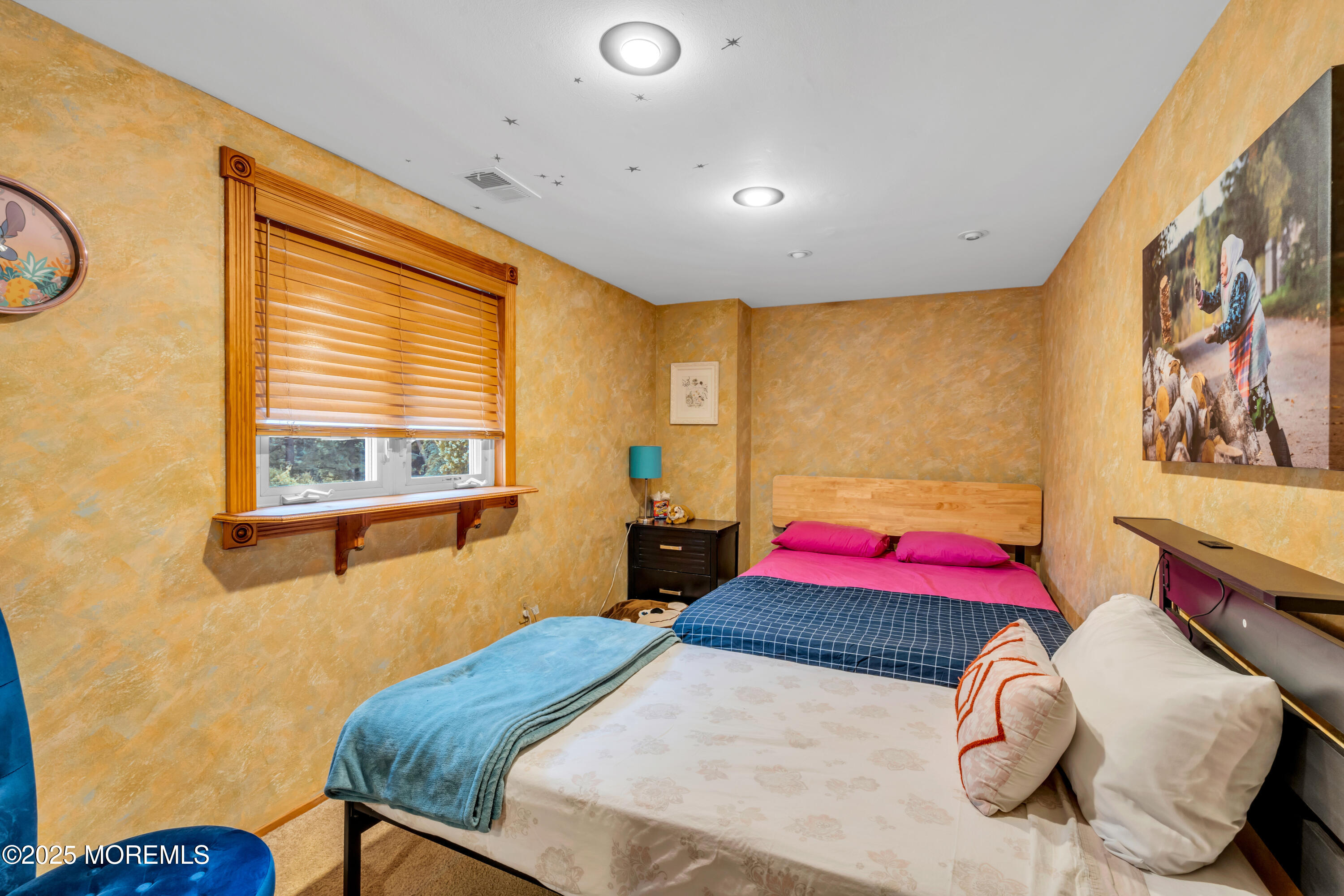 6 Hillcrest Road Manalapan, NJ 07726 - Photo 16 of 25 a bedroom with a bed and dresser with wooden floor