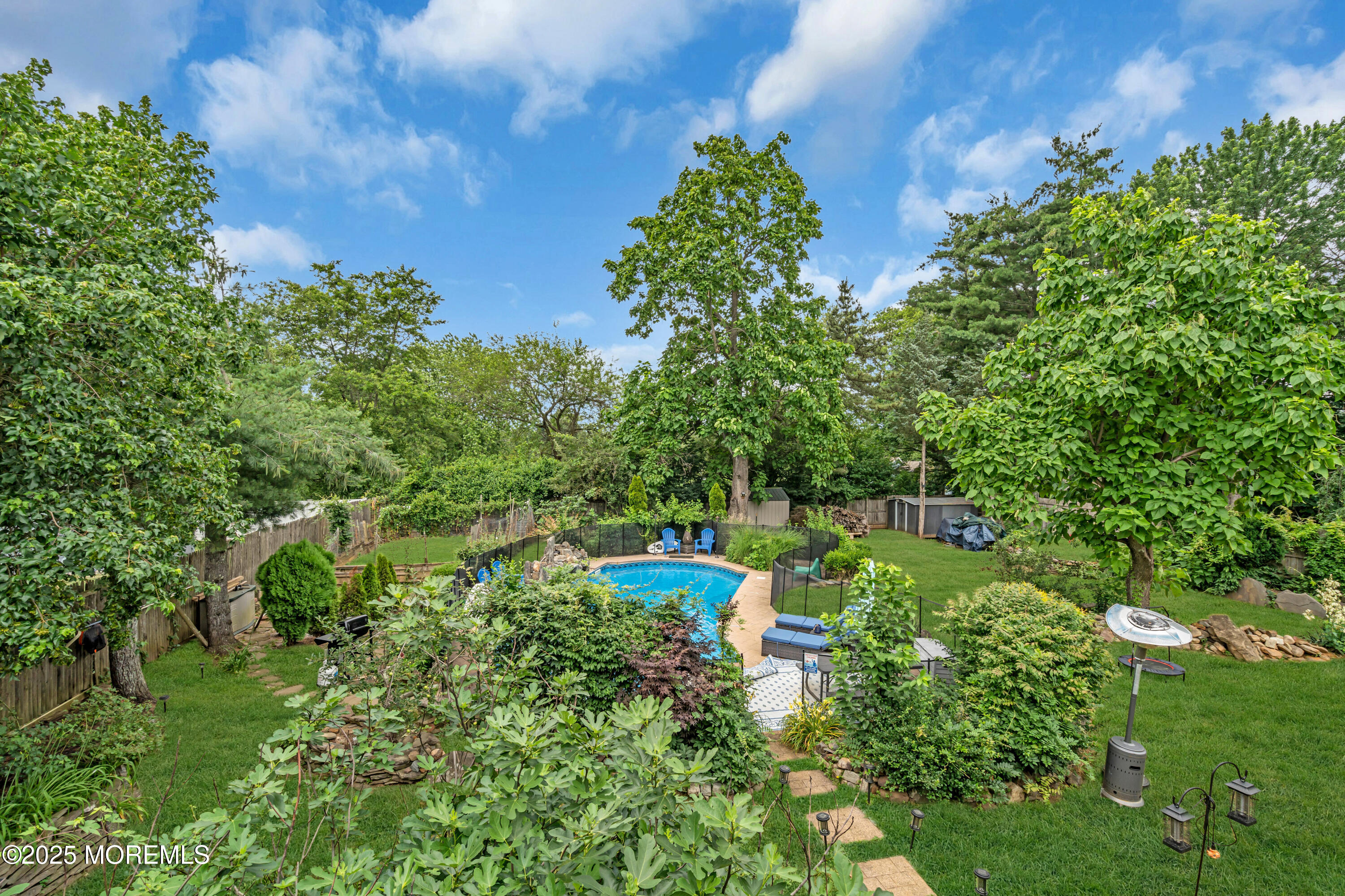 6 Hillcrest Road Manalapan, NJ 07726 - Photo 20 of 25 a view of a garden with lawn chairs