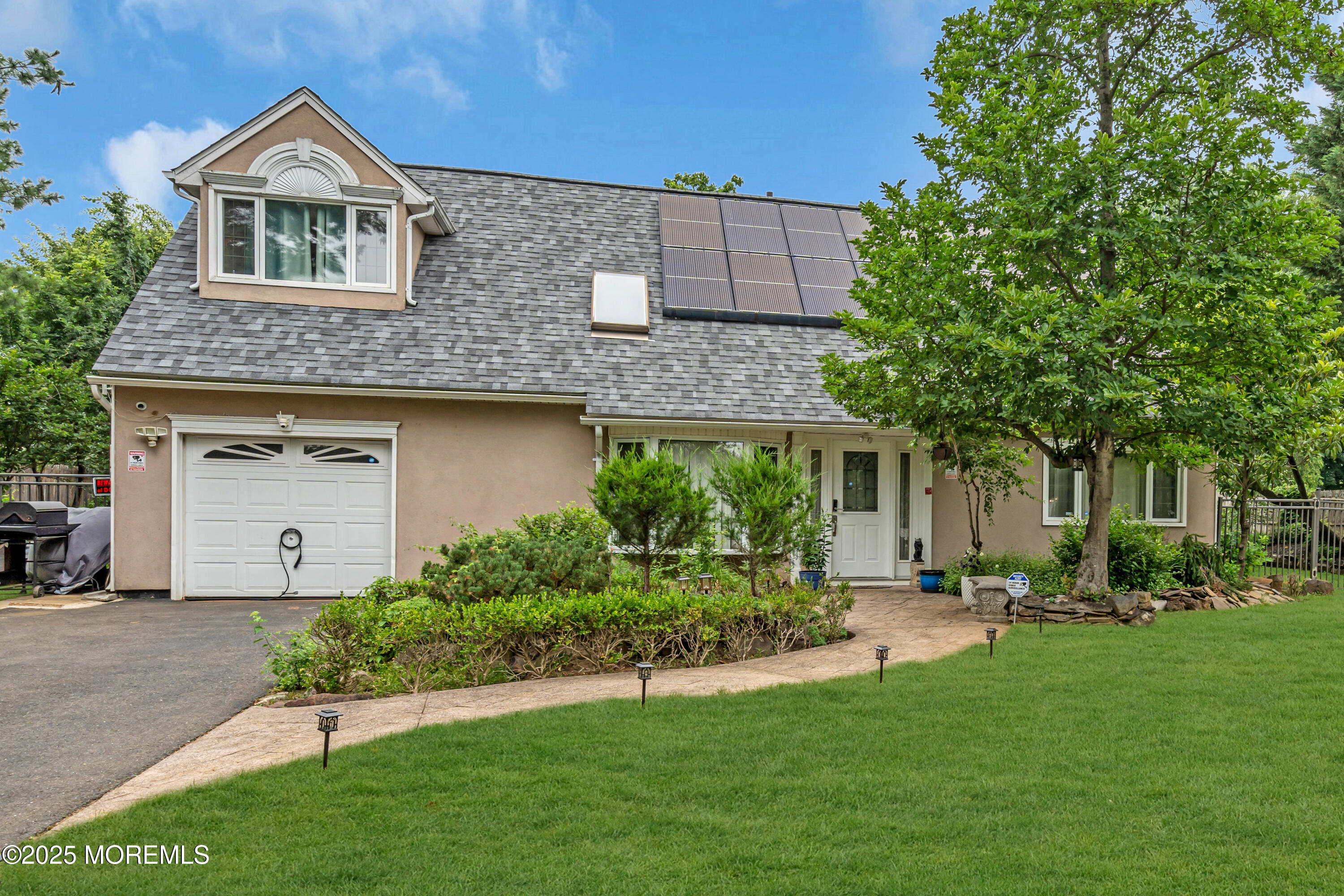 6 Hillcrest Road Manalapan, NJ 07726 - Photo 2 of 25 a front view of a house with a yard