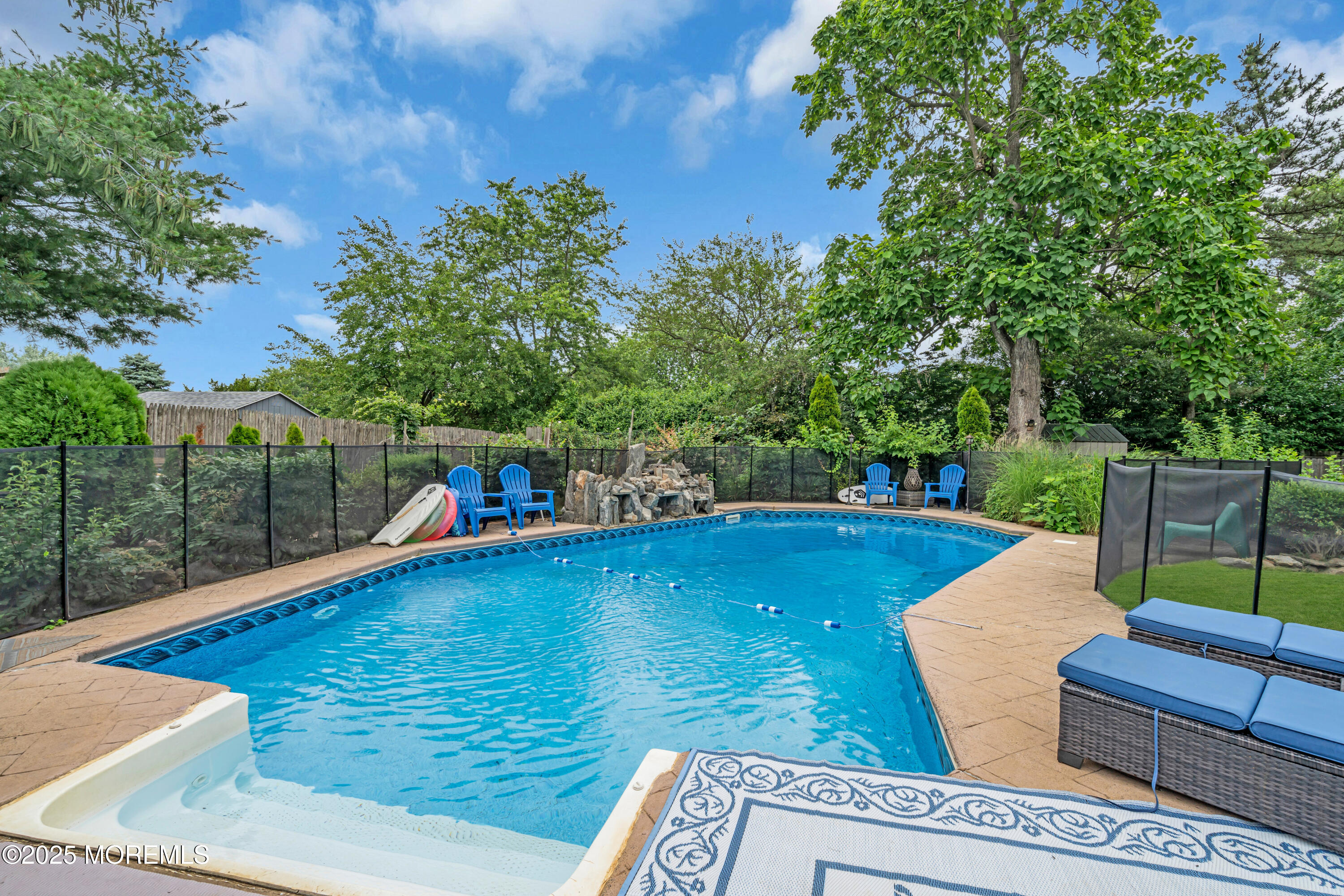 6 Hillcrest Road Manalapan, NJ 07726 - Photo 23 of 25 a view of a swimming pool with a patio