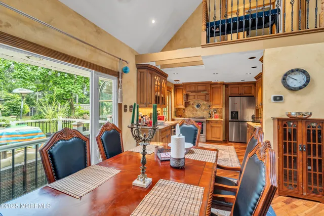 a view of a dining room with furniture window and outside view