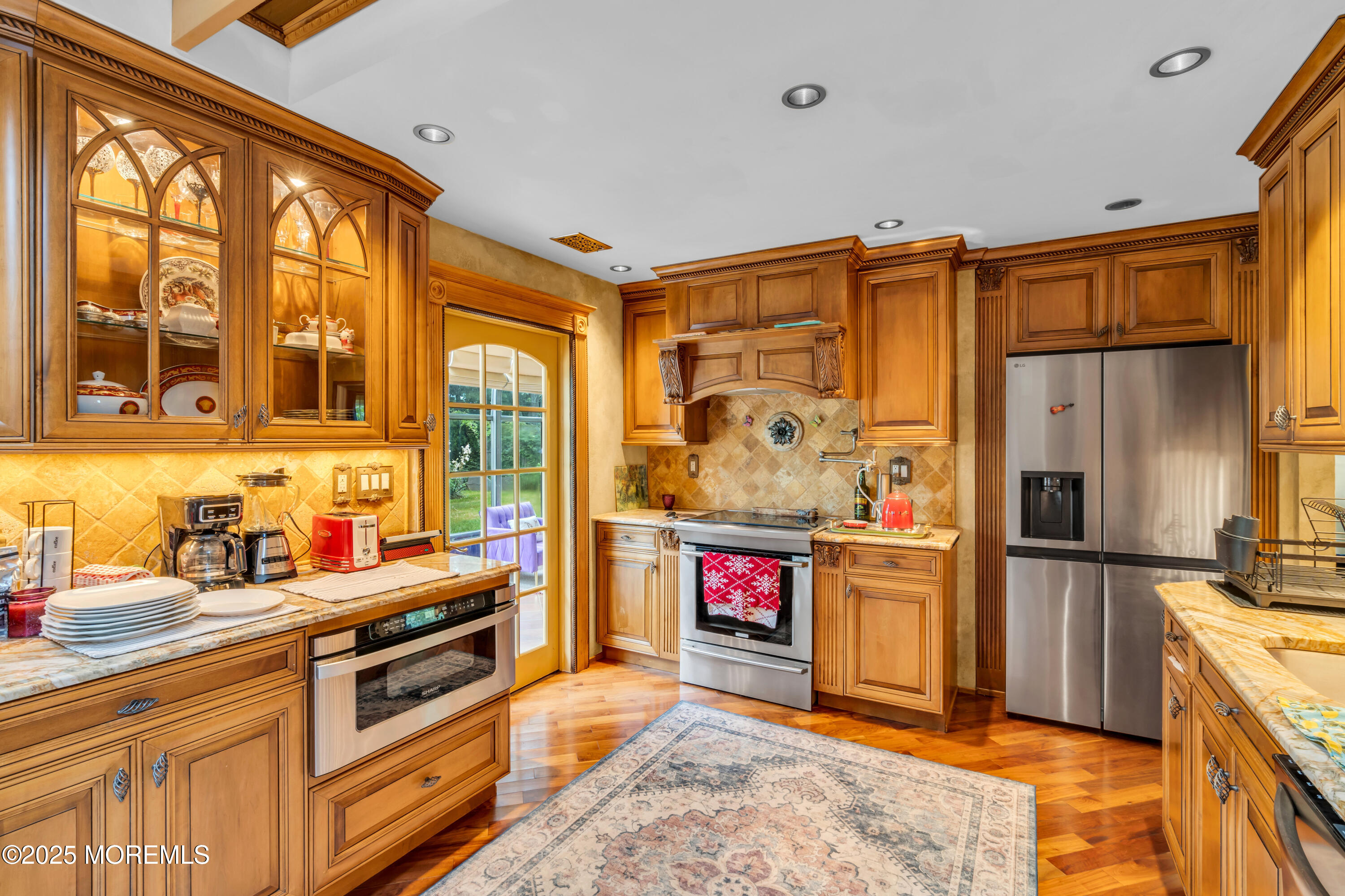 6 Hillcrest Road Manalapan, NJ 07726 - Photo 7 of 25 a kitchen with stainless steel appliances a stove and refrigerator